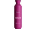 Pink bottle of Wildfleur clarifying cleanser on a white background