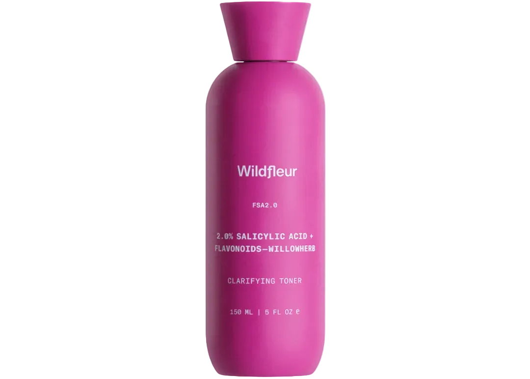 Pink bottle of Wildfleur clarifying toner on a white background