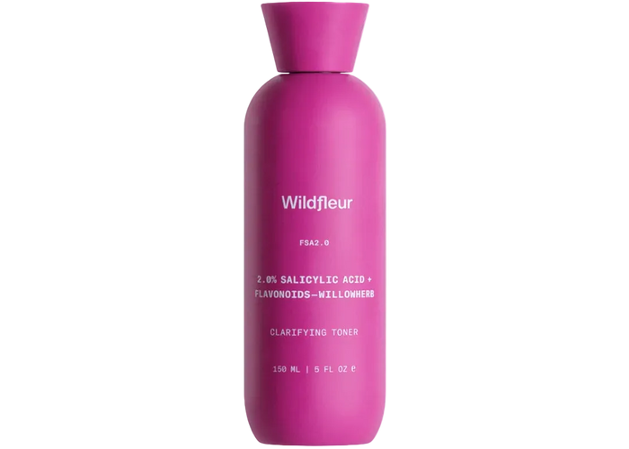 Pink bottle of Wildfleur clarifying toner on a white background