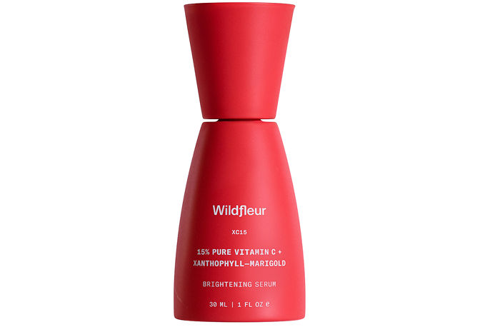 Red serum bottle with 'Wildfleur' branding on a white background