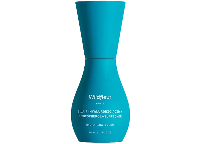 Blue serum bottle with 'Wildfleur' branding on a white background
