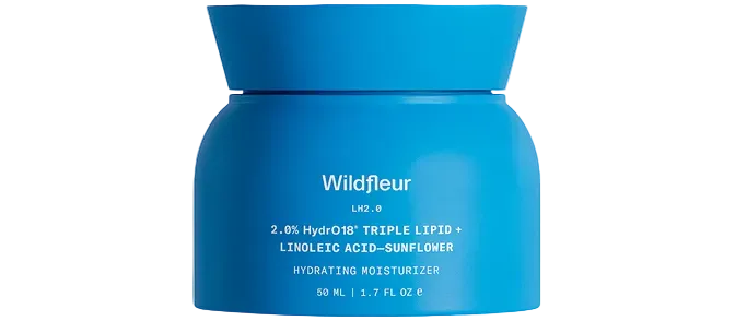 Blue jar of Wildfleur moisturizer on a white background