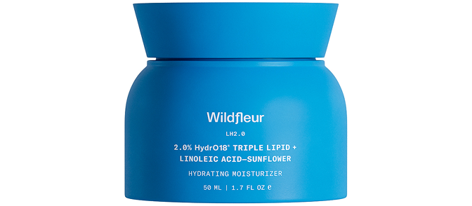 Blue jar of Wildfleur moisturizer on a white background