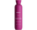 Pink bottle of Wildfleur clarifying cleanser on a white background