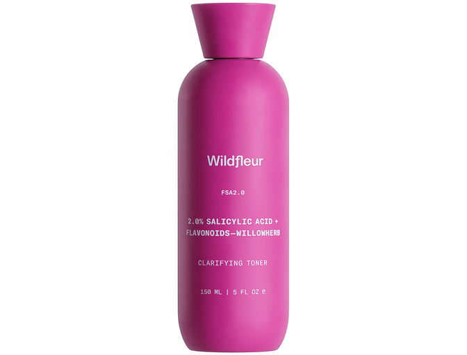 Pink bottle of Wildfleur clarifying toner on a white background