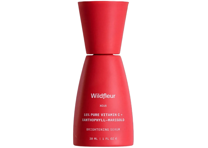 Red serum bottle with 'Wildfleur' branding on a white background